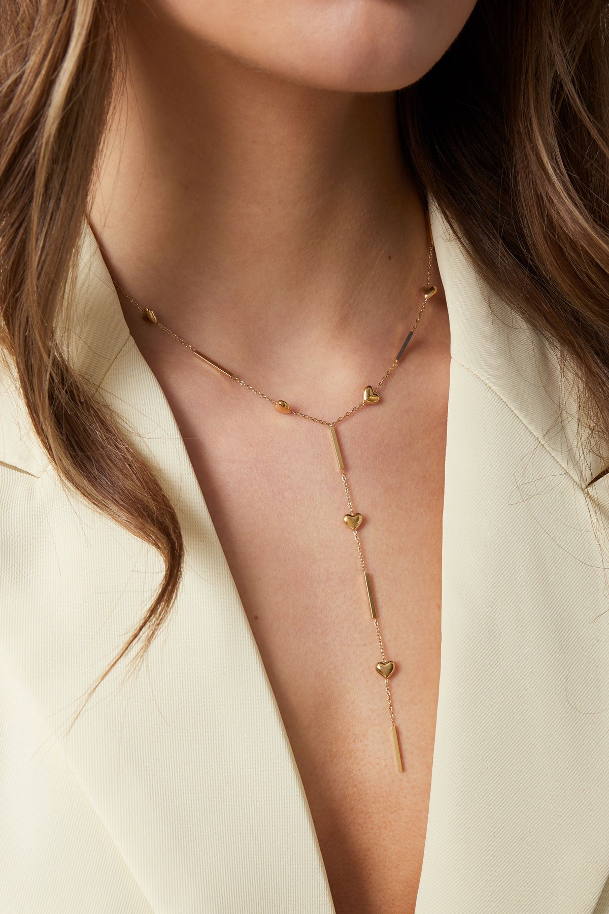Gouden Y-ketting met kleine hartjes details van stainless steel
