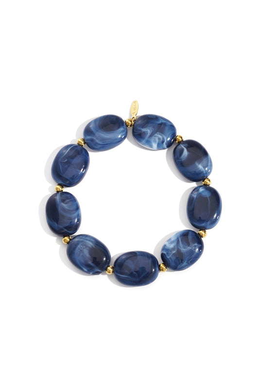 Blauwe acryl statement armband dames met goudkleurige RVS details